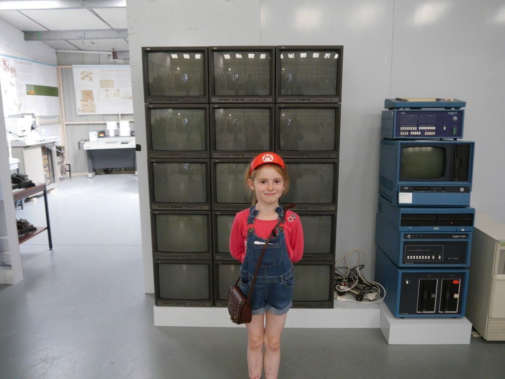 Child and a bank of monitors