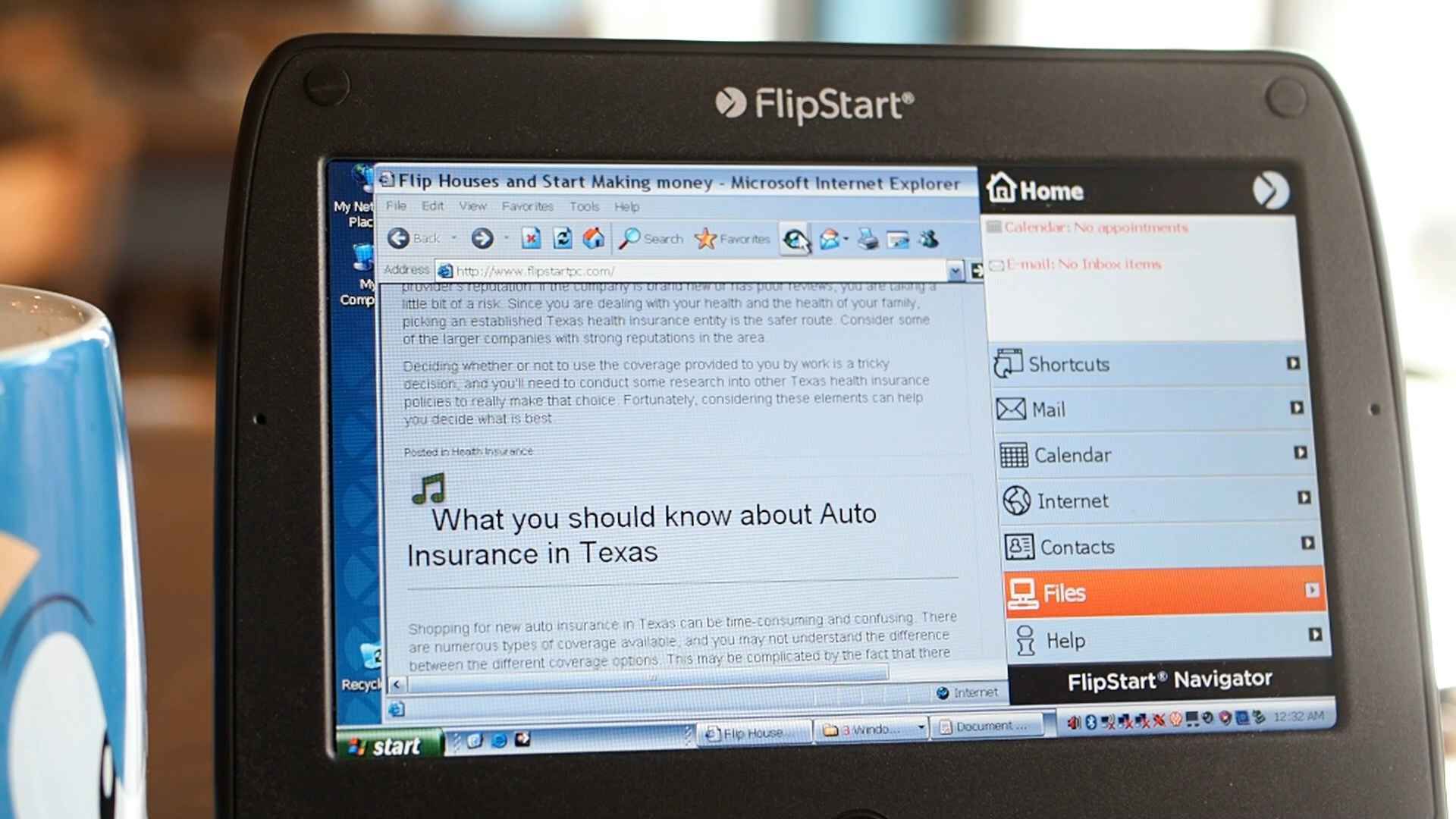 FlipStart running Windows XP, showing a web browser alongside the FlipStart Navigator menu