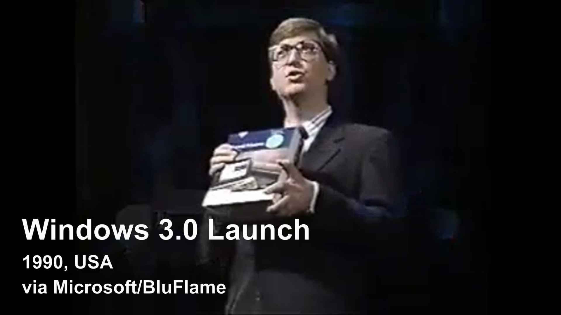 Bill Gates holding Windows 3.0 at the New York launch event