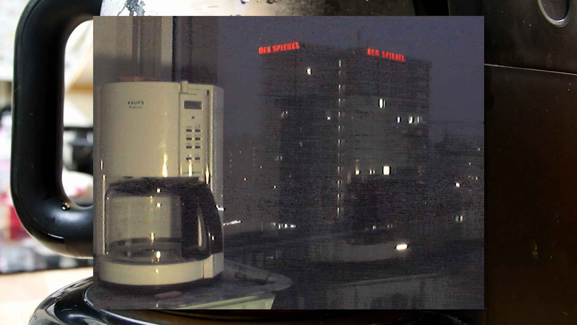 Coffee Pot live on webcam with the Der Spiegel building illuminated in the background