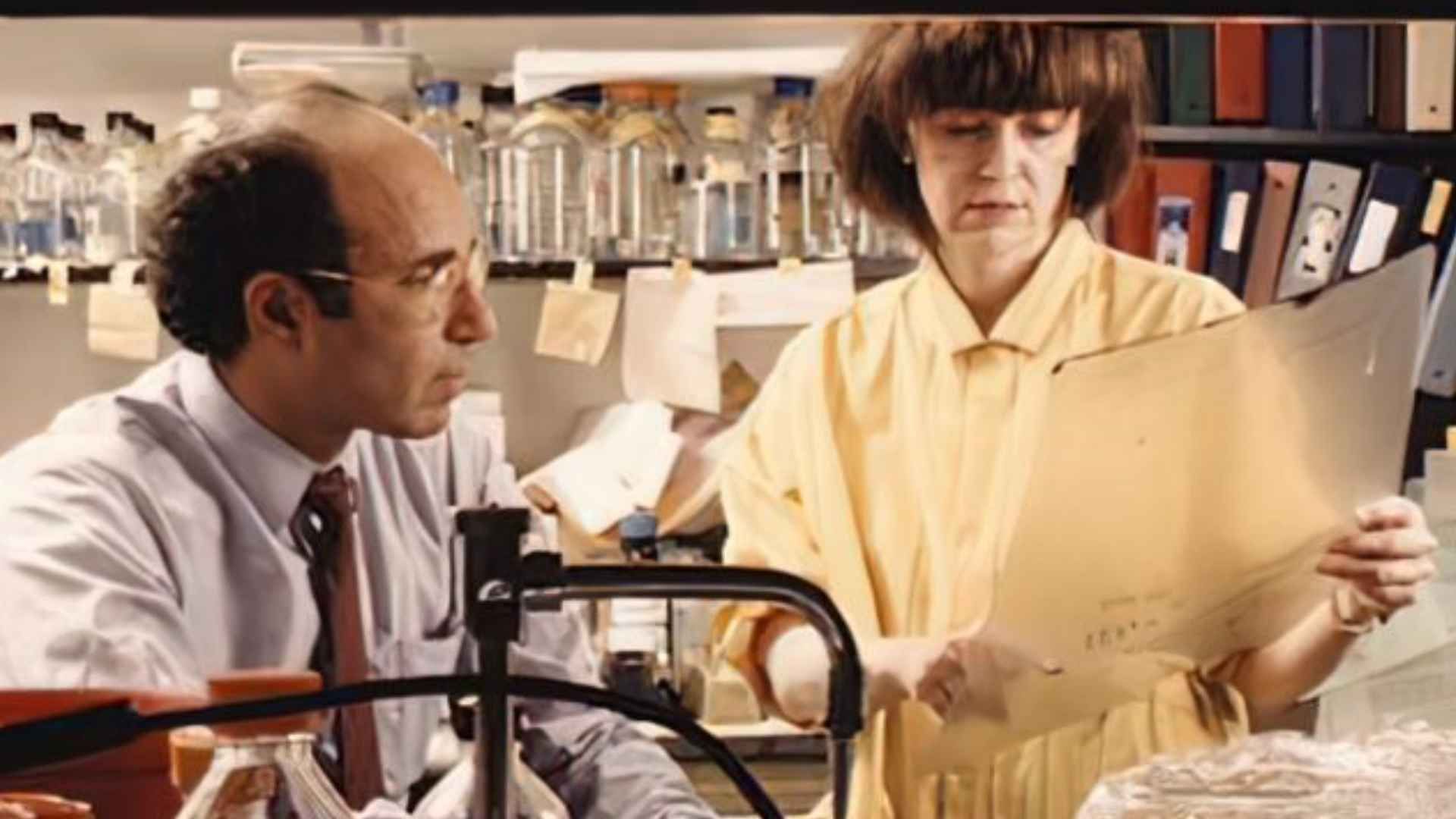 Linda Buck standing next to a chemist